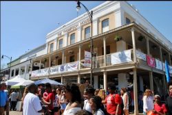 A photo of a building surrounded by a crowd of people