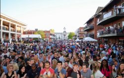 A photo of a large crowd watching a performance.