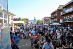 A photo of a crowd of people attending in the Double Decker Festival.