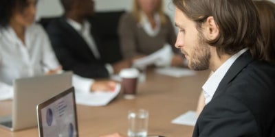 maxxsouth blog, benefits of upgrading to a gig for business, businessman in a meeting