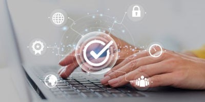 maxxcimmunity, small business cybersecurity, woman using laptop for security