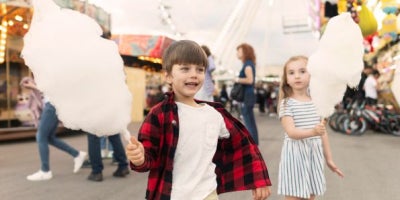 maxxcommunity blog, kids at fall festival with cotton candy, festivals in mississippi, mississippi festivals