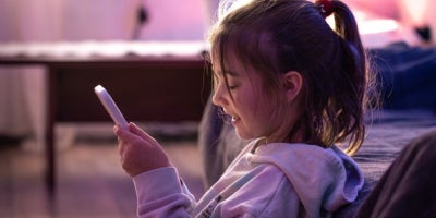 maxxcommunity blog, bark parental controls, little girl on phone, online safety