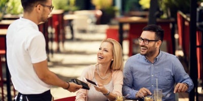 maxxcommunity blog, get repeat customers, restaurant industry, guest wifi, image of couple eating lunch