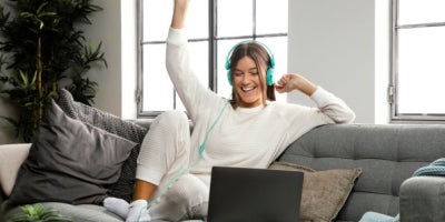 maxxsouth blog, switch to fiber, fiber internet, girl cheering on laptop