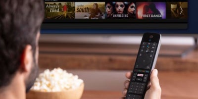 choosing a streaming service, streaming tv, man watching streaming service