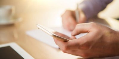 how to change your phone number, image of hands holding phone