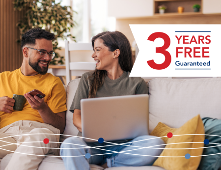 People using laptop and a banner which says '3 Years Free Guaranteed'