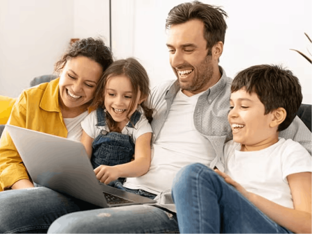 Family looking at laptop screen