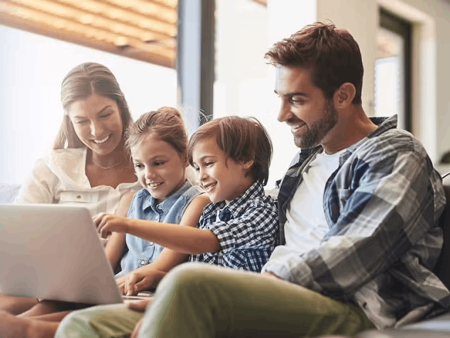 Family looking at laptop screen