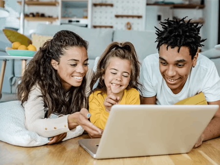 Family looking at laptop screen