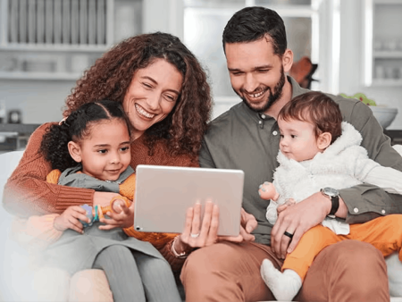 Family looking at tablet screen