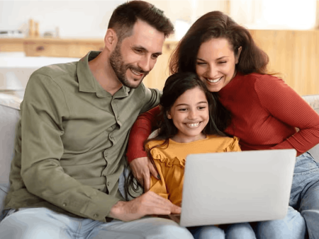 Family looking at laptop screen