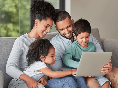 Family looking at laptop screen