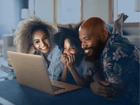 Family looking at laptop screen
