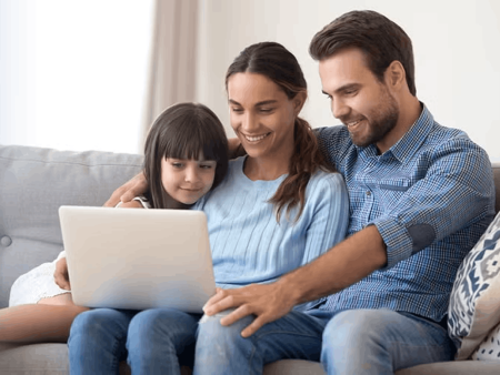 Family looking at laptop screen
