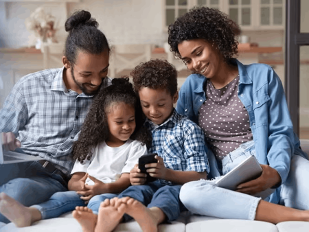 Family looking at smartphone screen