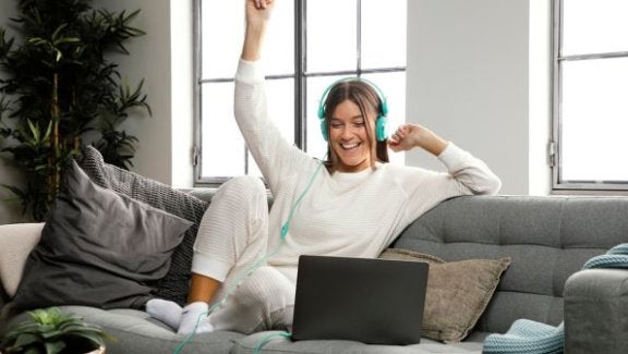 maxxsouth blog, switch to fiber, fiber internet, girl cheering on laptop