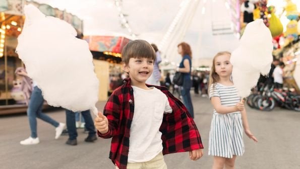 maxxcommunity blog, kids at fall festival with cotton candy, festivals in mississippi, mississippi festivals