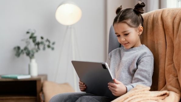 maxxcommunity blog, monitor children online, parental controls, little girl on tablet