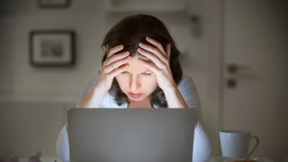 maxxcommunity blog, woman stressed on computer, troubleshooting internet issues