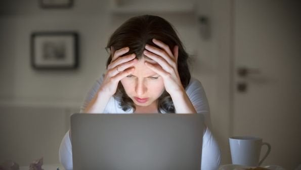 maxxcommunity blog, woman stressed on computer, troubleshooting internet issues