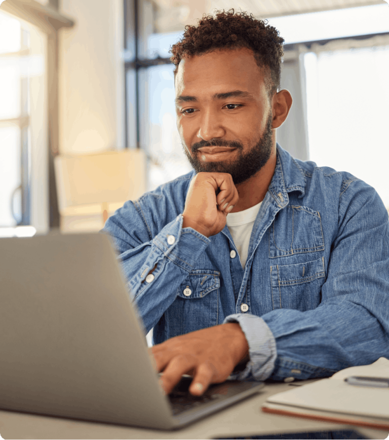 Man using laptop on desk