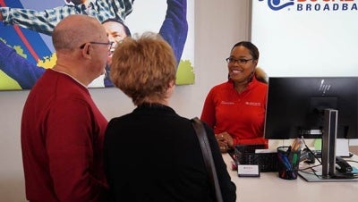 MaxxSouth Oxford Retail Store with smiling employee helping customers