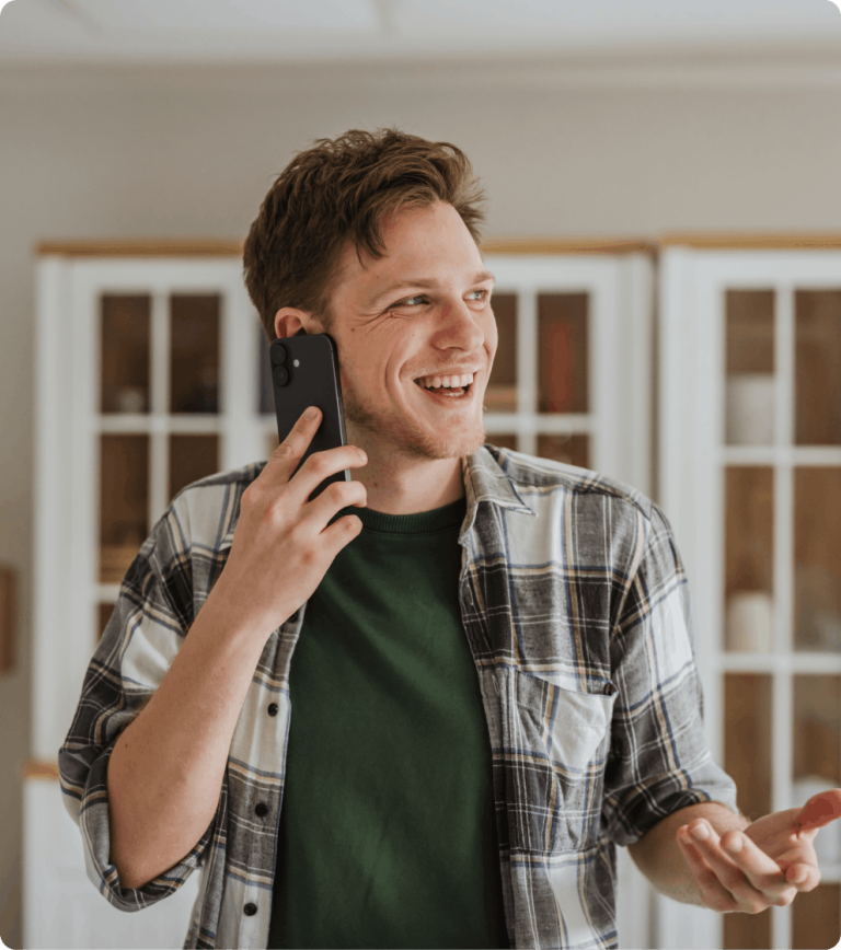 man talking on phone and using hand motions